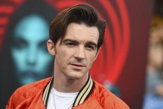FILE - Drake Bell appears at the world premiere of "The Spy Who Dumped Me" in Los Angeles on  July 25, 2018. Bell has been sentenced to two years of probation to charges relating to a teen whom he met online and who attended one of his 2017 concerts in Cleveland when she was 15. (Photo by Jordan Strauss/Invision/AP, File)