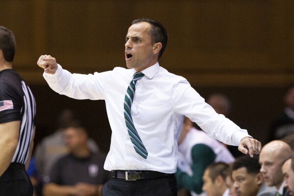 FILE - Northwest Missouri State head coach Ben McCollum shouts to his team during an NCAA college basketball game in Durham, N.C., Oct. 26, 2019. Drake hired McCollum as its basketball coach Monday, April1, 2024, entrusting the longtime and ultra-successful coach from Division II Northwest Missouri State with continuing the momentum the Bulldogs had under Darian DeVries. (AP Photo/Ben McKeown, File)