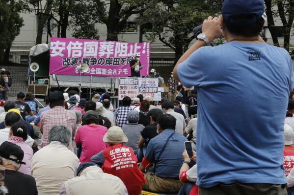 Protesters gather a park in Tokyo Friday, Sept. 23, 2022, demanding the cancellation of former Japanese Prime Minister Shinzo Abe’s state funeral. (AP Photo/Yuri Kageyama)