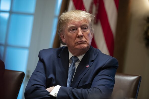 President Donald Trump listens during a roundtable on school choice in the Cabinet Room of the White House, Monday, Dec. 9, 2019, in Washington. (AP Photo/ Evan Vucci)