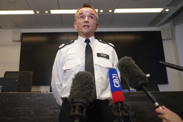 Commander Jon Savell speaks to the media at Scotland Yard in London, Friday Feb. 9, 2024. Alkali attack suspect Abdul Ezedi is believed to have 
