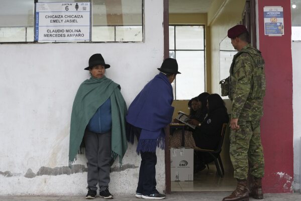 Women line up to vote in the presidential election runoff in Latacunga, Ecuador. Sunday, April 13, 2025. (AP Photo/Dolores Ochoa)