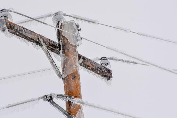 In this image provided by Verendrye Electric Cooperative, an ice-covered power line is seen in North Dakota. Ugly weather in North Dakota has left at least 19,000 people in the western part of the state facing days without power. It also left thousands residents along the Red River that separates the state from Minnesota dealing with flash flooding. (Courtesy of Verendrye Electric Cooperative via AP)