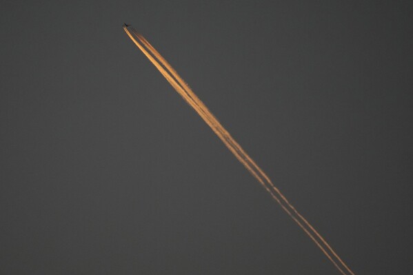 A plane flies over Oakland Alameda Coliseum in Oakland, Calif., April 30, 2024. (AP Photo/Jeff Chiu, File)