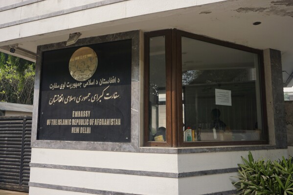A notice with emergency numbers is seen at the entrance of the Afghan embassy in New Delhi, India, Friday, Nov. 24, 2023, on the day the embassy announced its permanently closure due to challenges from the Indian government and a lack of diplomatic support. In a press release, it said the decision follows the embassy's earlier move to cease operations starting Oct. 1 due to the absence of a recognized government in Kabul. The Embassy in India was run by staff appointed by the previous government of ousted Afghan President Ashraf Ghani, with permission from Indian authorities. (AP Photo/Dinesh Joshi)