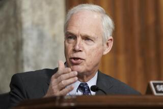 FILE - In this March 3, 2021 file photo, Sen. Ron Johnson, R-Wis., speaks during a Senate Committee on Homeland Security and Governmental Affairs and Senate Committee on Rules and Administration joint hearing examining the January 6, attack on the U.S. Capitol in Washington.  Critics of  Johnson are calling him racist after he told an interviewer on Thursday, March 11, that he wasnâ€™t worried about the supporters of former President Donald Trump who stormed the U.S. Capitol in January, but might have been concerned if they had been Black Lives Matter protesters. (Greg Nash/Pool via AP)