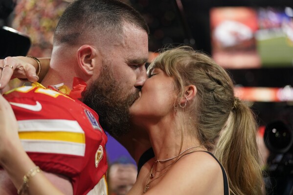 Taylor Swift kisses Kansas City Chiefs tight end Travis Kelce after the NFL Super Bowl 58 football game against the San Francisco 49ers, Sunday, Feb. 11, 2024, in Las Vegas. The Chiefs won 25-22 against the 49ers. (APPhoto/Brynn Anderson)