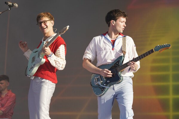 FILE - Dave Bayley, left, and Drew McFarland of Glass Animals performs at Lollapalooza Music Festival in Chicago on July 29, 2022. The English indie-pop band releases its fourth album on July 19. (Photo by Rob Grabowski/Invision/AP, File)