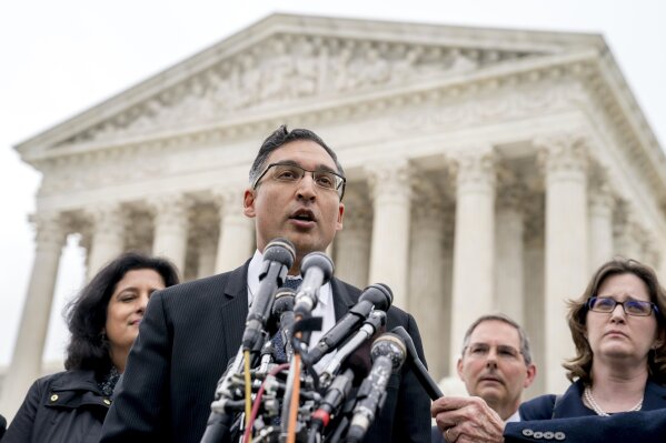 
              Neal Katyal, the attorney who argued against the Trump administration in the case Trump v. Hawaii, speaks to members of the media outside the Supreme Court, Wednesday, April 25, 2018, in Washington. President Donald Trump appears likely to win his travel ban case at the Supreme Court. Chief Justice John Roberts and Justice Anthony Kennedy both signaled support for the travel policy in arguments at the high court. The ban's challengers almost certainly need one of those two justices if the court is to strike down the ban on travelers from several mostly Muslim countries. (AP Photo/Andrew Harnik)
            