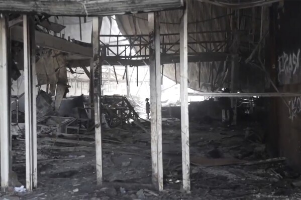 This image made from video shows the destroyed shopfront in Port Moresby, Papua New Guinea Thursday Jan. 11, 2024. The Papua New Guinea government worked to restore order Thursday after multiple people were reportedly killed during rioting and looting that left the country’s two biggest cities in flames. (Australian Broadcasting Corp. via AP)