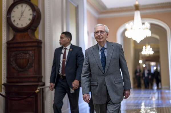 Senate Minority Leader Mitch McConnell, R-Ky., walks to the chamber as they vote to begin work on a package of wartime funding for Ukraine, Israel and other U.S. allies, at the Capitol in Washington, Thursday, Feb. 8, 2024. (APPhoto/J. Scott Applewhite)