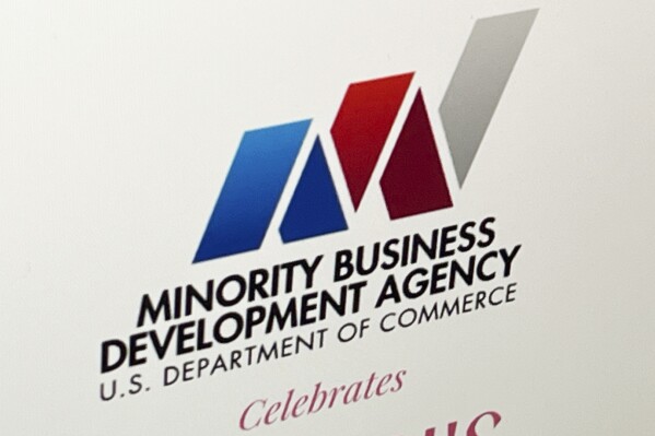 The logo for the Minority Business Development Agency is seen on their website on a computer in New York, Wednesday, March 6, 2024. A federal judge in Texas ordered the 55-year-old U.S. agency that caters to minority-owned businesses to serve people regardless of race, siding with white business owners who claimed the program discriminated against them. (AP Photo/Sydney Schaefer)