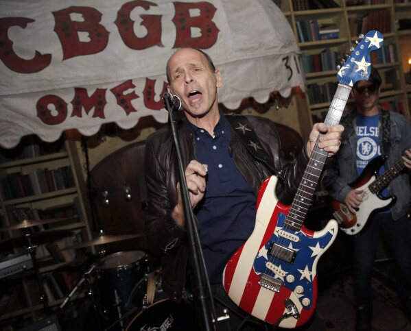 FILE - Wayne Kramer performs at the after party for the CBGB West Coast Premiere Powered by Ciroc at Hemingway's Lounge, Tuesday, Oct. 1, 2013, in Beverly Hills, Calif. Kramer, the co-founder of the protopunk Detroit band the MC5 that thrashed out such hardcore anthems as “Kick Out the Jams” and influenced everyone from the Clash to Rage Against the Machine, died Friday, Feb. 2, 2024. at Cedars-Sinai hospital in Los Angeles, according to Jason Heath, a close friend and executive director of Kramer's charity, Jail Guitar Doors. Heath said the cause of death was pancreatic cancer. He was 75.(Photo by Todd Williamson/Invision for Ciroc/AP, File)