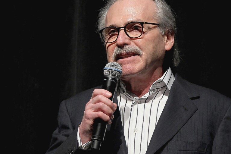 FILE - David Pecker, chairman and CEO of American Media, speaks at an event, Jan. 31, 2014 in New York. Pecker is The National Enquirer's former publisher and a longtime friend of Donald Trump. Prosecutors say he met with Trump and Trump's former lawyer Michael Cohen at Trump Tower in August 2015 and agreed to help Trump's campaign identify negative stories about him. (Marion Curtis via AP, File)