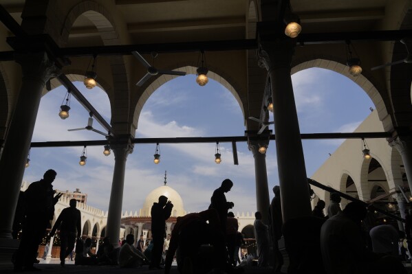 FILE - Muslims attend Friday prayers during the Muslims holy fasting month of Ramadan, at Amr ibn al-Aas Mosque, in Cairo, Egypt Friday, April 14, 2023. In the Middle East and North Africa, where religion is often ingrained in daily life's very fabric, rejecting faith can come with social or other repercussions, so many of the "nones," a group that includes agnostics, atheists and "nothing in particular" conceal that part of themselves, as blasphemy laws and policies are widespread in the region. (AP Photo/Amr Nabil, File)