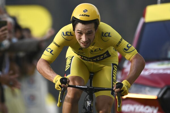 Slovenia's Primoz Roglic who lost the overall leader's yellow jersey to fellow countryman Tadej Pogacar, crosses the finish line of stage 20 of the Tour de France cycling race, an individual time trial over 36.2 kilometers (22.5 miles), from Lure to La Planche des Belles Filles, France, Saturday, Sept. 19, 2020. (Marco Bertorello/Pool via AP)