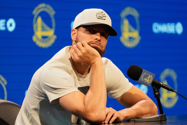Golden State Warriors guard Stephen Curry listens during a news conference at the NBA basketball team's facility in San Francisco, Thursday, May 15, 2025. (AP Photo/Jeff Chiu)