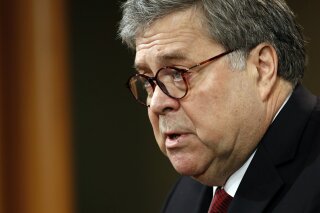 
              Attorney General William Barr speaks about the release of a redacted version of special counsel Robert Mueller's report during a news conference, Thursday, April 18, 2019, at the Department of Justice in Washington. (AP Photo/Patrick Semansky)
            