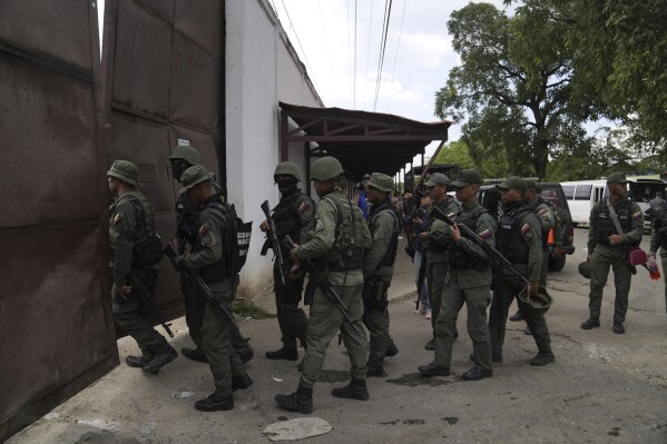 Soldiers raid the Tocorón Penitentiary Center, where the Tren de Aragua gang originated, in Tocorón, Venezuela, Sept. 20, 2023. (AP Photo/Ariana Cubillos, File)