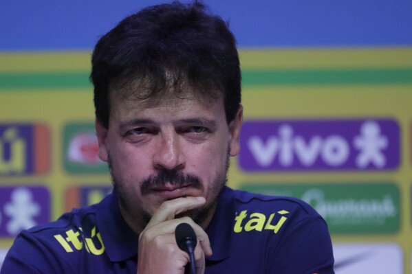 Brazil soccer coach Fernando Diniz gestures after announcing his squad for the upcoming World Cup 2026 qualifying matches against Bolivia and Peru in Rio de Janeiro, Brazil, Friday, Aug. 18, 2023. (AP Photo/Bruna Prado)