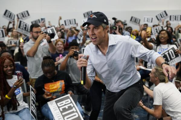 Texas Democratic gubernatorial candidate Beto O'Rourke, center, arrives for a rally at University of Texas at San Antonio (UTSA), Monday, Sept. 26, 2022, in San Antonio. O'Rourke is still trying to close in on Republican Gov. Greg Abbott with six week until Election Day. (AP Photo/Eric Gay)