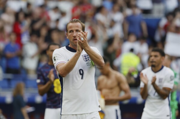 England's Harry Kane applauds to supporters at the end of a World Cup 2026 group K qualifying soccer match between Andorra and England at the RCDE Stadium in Barcelona, Spain, Saturday, June 7, 2025. (AP Photo/Joan Monfort)
