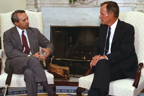 President George H.W. Bush talks with Supreme Court nominee Judge David Souter in the Oval Office of the White House, Sept. 13, 1990. (AP Photo/Charles Tasnadi, File)