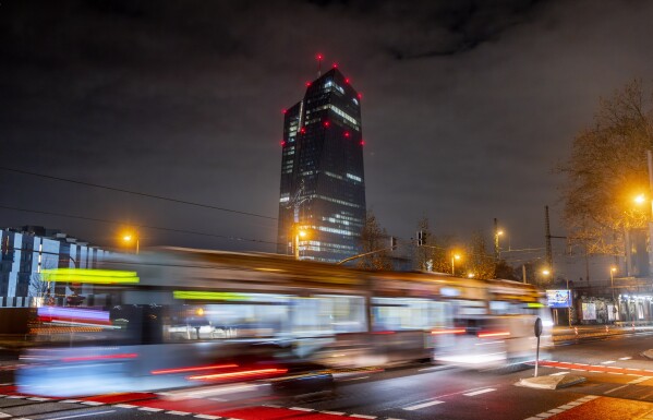 A tram passes the European Central Bank in Frankfurt, Germany, Thursday, Dec. 14, 2023. The U.S. Federal Reserve and most other major central banks spent most of the year deploying their interest-rate weapons against the worst bout of inflation in four decades. (AP Photo/Michael Probst)