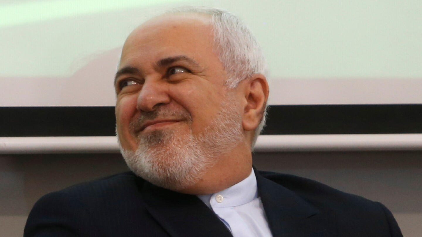 Iran’s president accepts resignation of 2015 nuclear deal figure as UN atomic chief due in Tehran