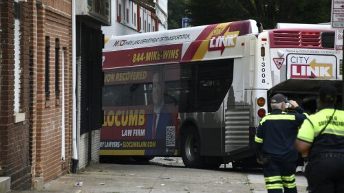 First responders work the scene of a multi-vehicle crash in Baltimore on Saturday, June 17, 2023. Police say several people were injured when a mass transit bus crashed with two cars before hitting a building. (Kim Hairston/The Baltimore Sun via AP)