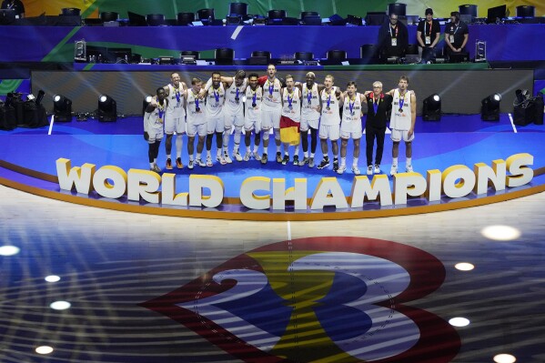 Germany poses with their gold medals after winning the championship game of the Basketball World Cup against Serbia in Manila, Philippines, Sunday, Sept. 10, 2023. (AP Photo/Aaron Favila)