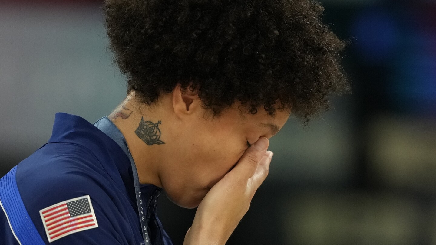 Brittney Griner sheds tears during the national anthem after winning gold