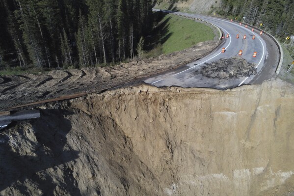 This photo provided by Wyoming Highway Patrol shows a damaged section of Teton Pass near Jackson, Wyo., on Saturday, June 8, 2024, that officials said had “catastrophically failed.” (Wyoming Highway Patrol via AP)