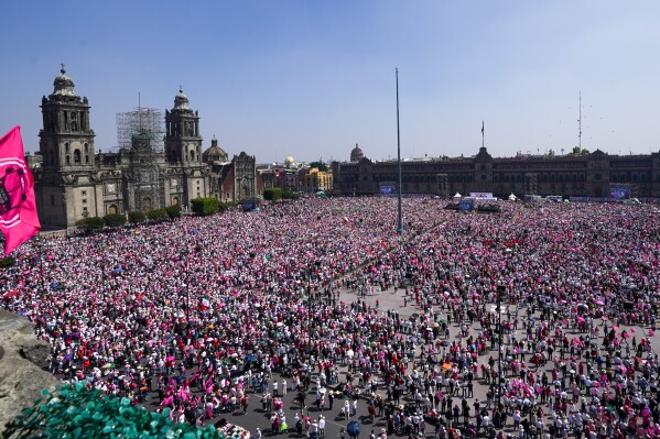 People take parte in a march organized by citizen organizations demanding that electoral autonomy be respected in the upcoming general elections in downtown Mexico City, Sunday, Feb. 18, 2024. General elections in which voters will elect a new president and legislators are scheduled for June 2. (AP Photo/Marco Ugarte)