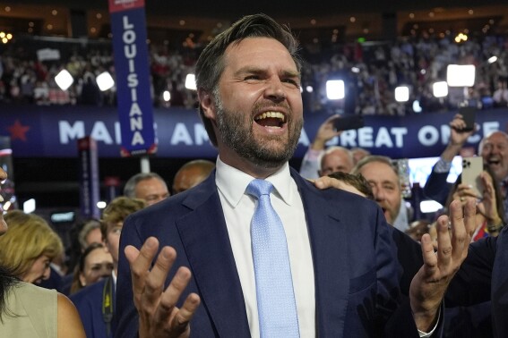Republican vice presidential candidate Sen. JD Vance, R-Ohio, arrives on the floor during the first day of the 2024 Republican National Convention at the Fiserv Forum, Monday, July 15, 2024, in Milwaukee. (AP Photo/Carolyn Kaster)