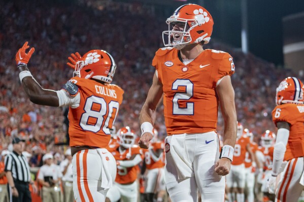 Clemson quarterback Cade Klubnik (2) reacts after throwing a touchdown pass against Florida Atlantic during the first half of an NCAA college football game Saturday, Sept. 16, 2023, in Clemson, S.C. (AP Photo/Jacob Kupferman)