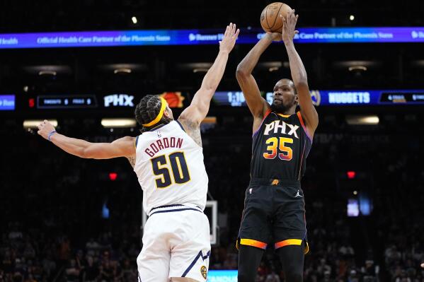 Phoenix Suns forward Kevin Durant (35) shoots over Denver Nuggets forward Aaron Gordon (50) during the first half of Game 4 of an NBA basketball Western Conference semifinal game, Sunday, May 7, 2023, in Phoenix. (AP Photo/Matt York)
