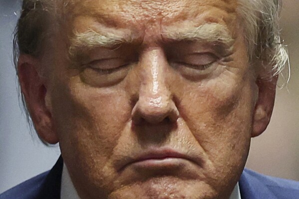 FILE - Former President Donald Trump closes his eyes during his trial at Manhattan criminal court May 16, 2024, in New York. Trump has spent the majority of his time as a criminal defendant sitting nearly motionless, for hours, leaning back in his chair with his eyes closed, so zen he often appeared to be asleep. It is, at least in part, a strategy in response to warnings that behaving like he has in past trials could backfire. (Mike Segar/Pool Photo via AP, File)