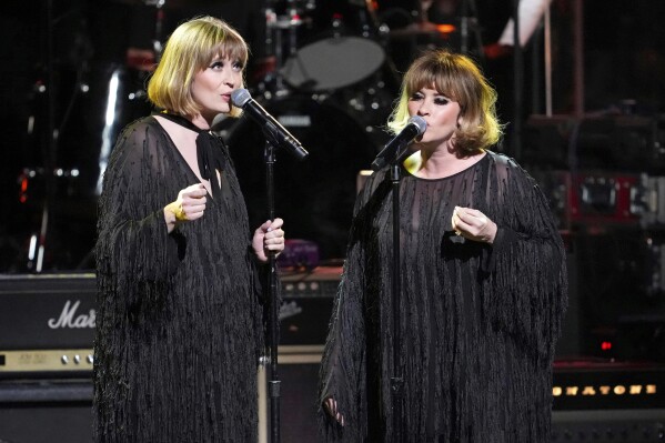Holly Laessig, left, and Jess Wolfe of Lucius perform at the 8th annual Love Rocks NYC concert on March 7, 2024, in New York. (Photo by Charles Sykes/Invision/AP, File)