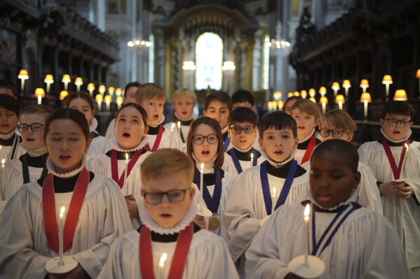 The Choristers of St Paul's choir, including girls for first time in 900-year history, rehearse for the Christmas services in St Paul's Cathedral, in London, Monday, Dec. 23 2024. (AP Photo/Kin Cheung)
