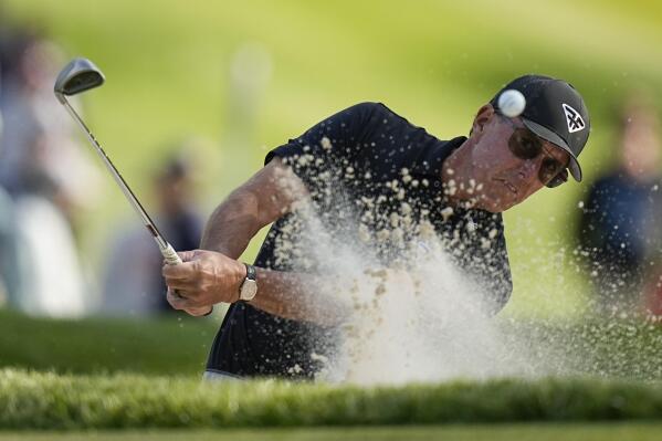 Phil Mickelson hits from the bunker on the seventh hole during the first round of the PGA Championship golf tournament at Oak Hill Country Club on Thursday, May 18, 2023, in Pittsford, N.Y. (AP Photo/Eric Gay)