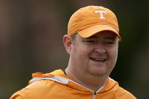 FILE - Tennessee NCAA college football coach Josh Heupel looks on during a team practice session ahead of the 2022 Orange Bowl, Tuesday, Dec. 27, 2022, in Miami Shores, Fla. The 12th-ranked Tennessee Volunteers are ready to see just what they can do in coach Josh Heupel's third season in an NFL stadium that essentially will be a home away from home while technically a neutral site. (AP Photo/Rebecca Blackwell, File)