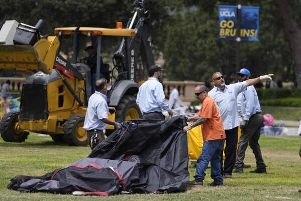 A tent is removed at the site of a pro-Palestinian encampment which was cleared by police overnight on the UCLA campus Thursday, May 2, 2024, in Los Angeles. (Ǻ Photo/Ashley Landis)