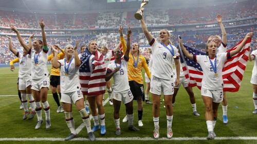 FILE - United States' players jump to celebrate with the trophy after winning the Women's World Cup final soccer match between US and The Netherlands at the Stade de Lyon in Decines, outside Lyon, France, Sunday, July 7, 2019. (AP Photo/Claude Paris, File)