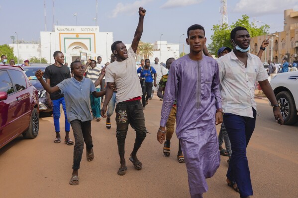 Supporters of Nigerien President Mohamed Bazoum demonstrate in his support in Niamey, Niger, Wednesday July 26 2023. Governing bodies in Africa condemned what they characterized as a coup attempt Wednesday against Niger's president, whose official Twitter account reported that elements of the presidential guard engaged in an "anti-Republican demonstration" and tried to obtain the support of other security forces. (AP Photo/Sam Mednick)