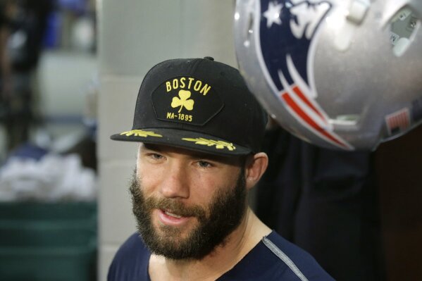 FILE - In this Nov. 16, 2016, file photo, New England Patriots wide receiver Julian Edelman speaks with reporters in the team's locker room before an NFL football team practice in Foxborough, Mass. Citing a knee injury that cut his 2020 season short after just six games, Edelman announced Monday, April 12, 2021, that he is retiring from the NFL after 11 seasons. (AP Photo/Steven Senne, File)