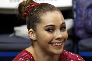 FILE - In this Aug. 17, 2013 file photo McKayla Maroney smiles after competing on the floor exercise during the U.S. women's national gymnastics championships in Hartford, Conn. Maroney says the group that trains U.S. Olympic gymnasts forced her to sign a confidential settlement to keep allegations of sexual abuse by the team's doctor secret. Maroney filed a lawsuit Wednesday, Dec. 20, 2017, in Los Angeles, against the United States Olympic Committee and USA Gymnastics. The suit also seeks damages from Michigan State University, where the team's doctor, Larry Nassar, worked for decades. (AP Photo/Elise Amendola,File)
