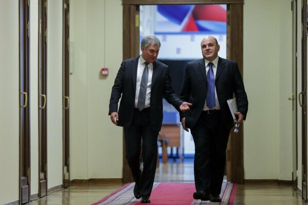 In this photo provided by The State Duma, The Federal Assembly of The Russian Federation, Russian State Duma speaker Vyacheslav Volodin, left, and Russian Tax Service chief Mikhail Mishustin, who was nominated to replace Medvedev, walk in the State Duma, the Lower House of the Russian Parliament in Moscow, Russia, Thursday, Jan. 16, 2020. Russian President Vladimir Putin has named tax service chief Mikhail Mishustin as Russia's new prime minister. (The State Duma, The Federal Assembly of The Russian Federation via AP)