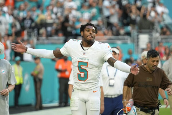 Miami Dolphins cornerback Jalen Ramsey (5) celebrates after intercepting a pass in the end zone during the second half of an NFL football game against the Las Vegas Raiders, Sunday, Nov. 19, 2023, in Miami Gardens, Fla. The Dolphins defeated the Raiders 20-13. (AP Photo/Rebecca Blackwell)