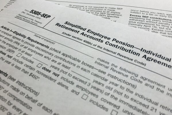 
              FILE - In this Monday, April 2, 2018, file photo, an IRS Form 5305, Simplified Employee Pension — Individual Retirement Accounts Contribution Agreement is shown in New York. Americans generally do not have enough saved for retirement and Congress is considering a number of measures to address that. Research has shown one of the most effective ways to get people to save is through access to a workplace retirement plan. But millions of Americans do not have access to such plans, particularly at small businesses where the cost and complexity hinders some companies from establishing one. (AP Photo/Jenny Kane, File)
            